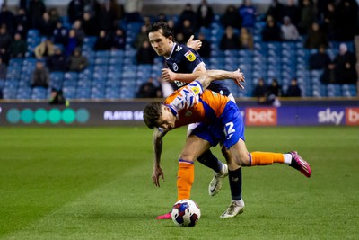 140323 - Millwall v Swansea City - Sky Bet Championship - Jamie Paterson of Swansea City and Duncan Watmore of Millwall battle for the ball