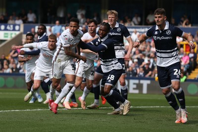 260425 - Millwall v Swansea City - Sky Bet Championship - Players tussle as a corner is taken 