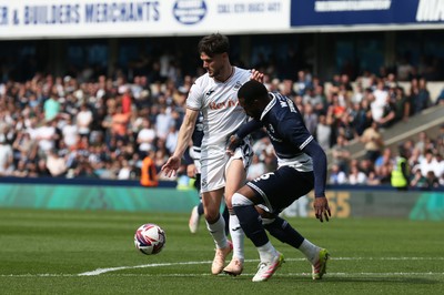 260425 - Millwall v Swansea City - Sky Bet Championship - Liam Cullen of Swansea holds up the ball under pressure from Japhet Tanganga  of Millwall