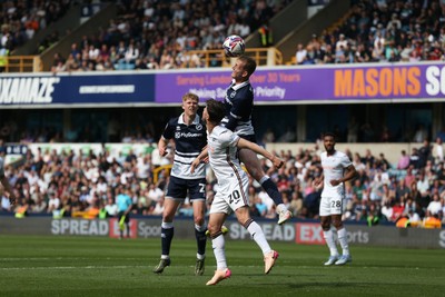 260425 - Millwall v Swansea City - Sky Bet Championship - Liam Cullen of Swansea  beaten to the ball in the air 
