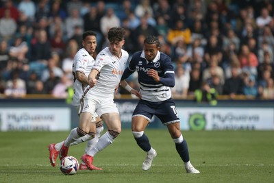 260425 - Millwall v Swansea City - Sky Bet Championship - Josh Key of Swansea tussles with Femi Azeez of Millwall