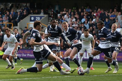 260425 - Millwall v Swansea City - Sky Bet Championship - Ollie Cooper of Swansea can’t connect as he’s crowded out by Millwall defence