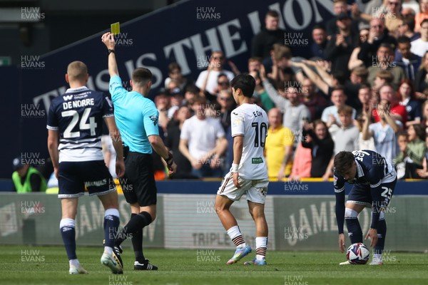 260425 - Millwall v Swansea City - Sky Bet Championship - Eom Ji-Sung of Swansea is shown a yellow card by referee Ben Speedie