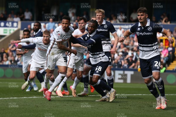 260425 - Millwall v Swansea City - Sky Bet Championship - Players tussle as a corner is taken 