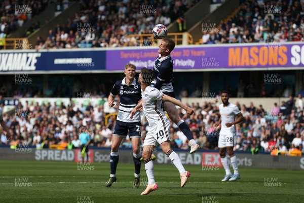 260425 - Millwall v Swansea City - Sky Bet Championship - Liam Cullen of Swansea  beaten to the ball in the air 