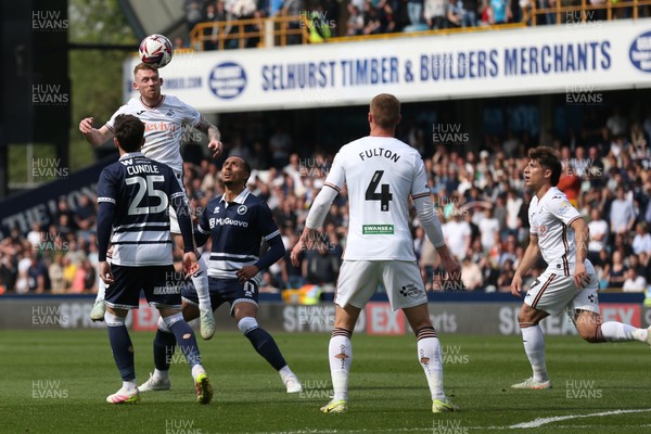 260425 - Millwall v Swansea City - Sky Bet Championship - Lewis O'Brien of Swansea heads the ball 