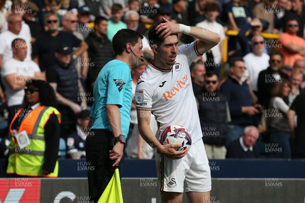 260425 - Millwall v Swansea City - Sky Bet Championship - Josh Key of Swansea talks to the assistant referee