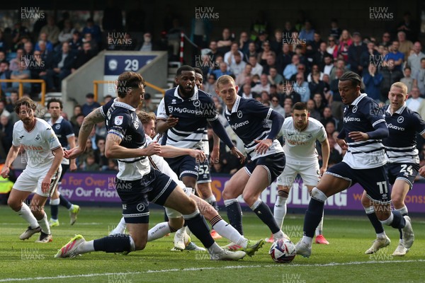 260425 - Millwall v Swansea City - Sky Bet Championship - Ollie Cooper of Swansea can’t connect as he’s crowded out by Millwall defence