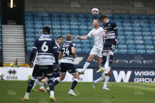 260425 - Millwall v Swansea City - Sky Bet Championship - Lewis O'Brien of Swansea goes up for a header