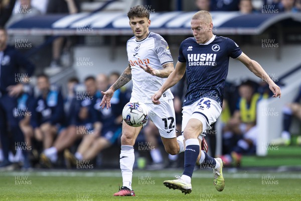 300923 - Millwall v Swansea City - Sky Bet Championship - Casper de Norre of Millwall in action against Jamie Paterson of Swansea City