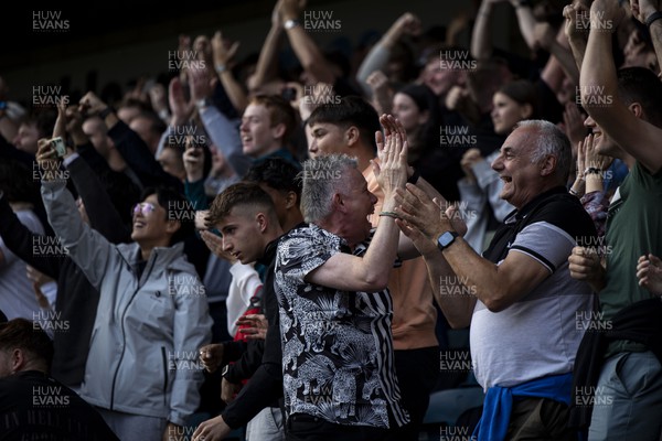 300923 - Millwall v Swansea City - Sky Bet Championship - Swansea City supporters celebrating their sides second goal 