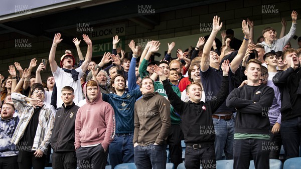 300923 - Millwall v Swansea City - Sky Bet Championship - Swansea City supporters celebrate their sides third goal 