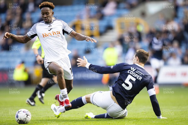 300923 - Millwall v Swansea City - Sky Bet Championship - Jamal Lowe of Swansea City in action against Jake Cooper of Millwall