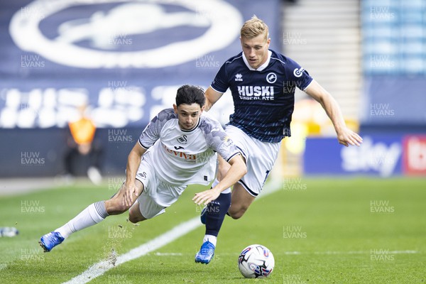 300923 - Millwall v Swansea City - Sky Bet Championship - Zian Flemming of Millwall fouls Charlie Patino of Swansea City