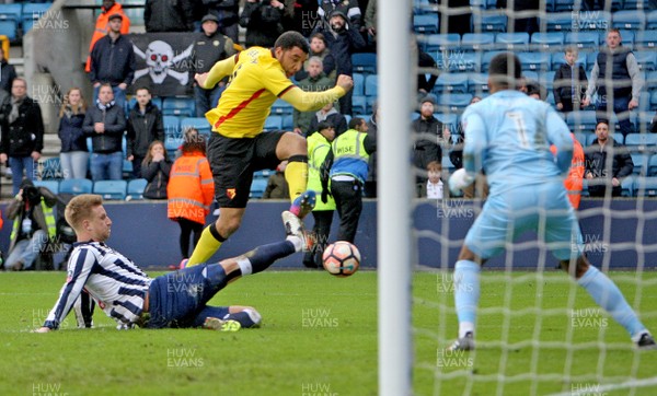 290117 - Millwal FC vs Watford FC -  Emirates FA Cup 4th Round - Byron Webster of Millwall gets in a great tackle to deny Troy Deeney in the ting seconds