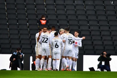 140226 - Milton Keynes Dons v Newport County - Sky Bet League 2 - MK Dons players celebrate their first goal