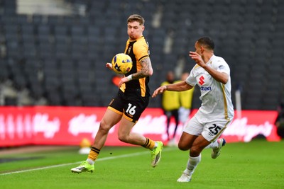 140226 - Milton Keynes Dons v Newport County - Sky Bet League 2 - James Crole of Newport County and Curtis Nelson of MK Dons 