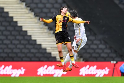 140226 - Milton Keynes Dons v Newport County - Sky Bet League 2 - Anthony Driscoll-Glennon of Newport County and Callum Paterson of MK Dons compete for a header