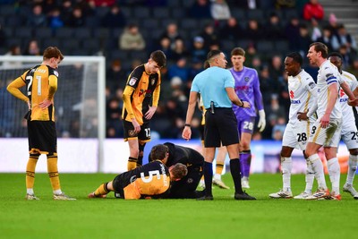 140226 - Milton Keynes Dons v Newport County - Sky Bet League 2 - Sven Sprangler of Newport County is treated for an injury