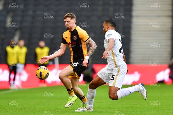 140226 - Milton Keynes Dons v Newport County - Sky Bet League 2 - James Crole of Newport County and Curtis Nelson of MK Dons 