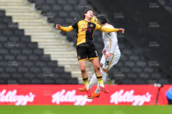 140226 - Milton Keynes Dons v Newport County - Sky Bet League 2 - Anthony Driscoll-Glennon of Newport County and Callum Paterson of MK Dons compete for a header