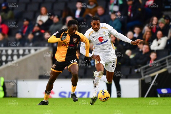 140226 - Milton Keynes Dons v Newport County - Sky Bet League 2 - Nathan Opoku of Newport County competes with Marvin Ekpiteta of MK Dons 