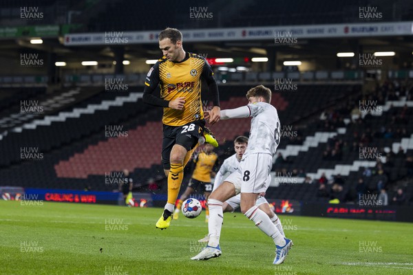 221122 - Milton Keynes Dons v Newport County - Papa Johns Trophy -  Mickey Demetriou of Newport County is challenged by  Ethan Robson of Milton Keynes Dons