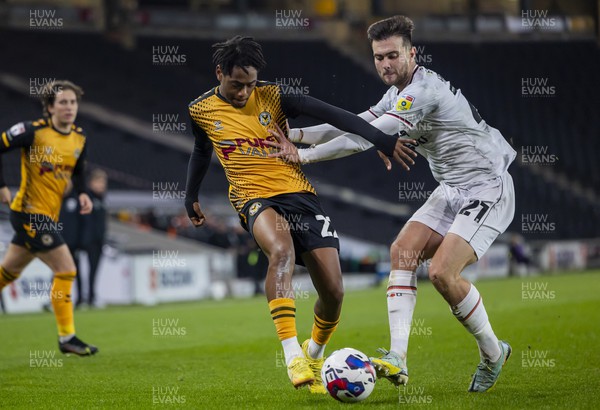 221122 - Milton Keynes Dons v Newport County - Papa Johns Trophy -  Nathan Moriah-Welsh of Newport County is challenged by Daniel Harvie of Milton Keynes Dons
