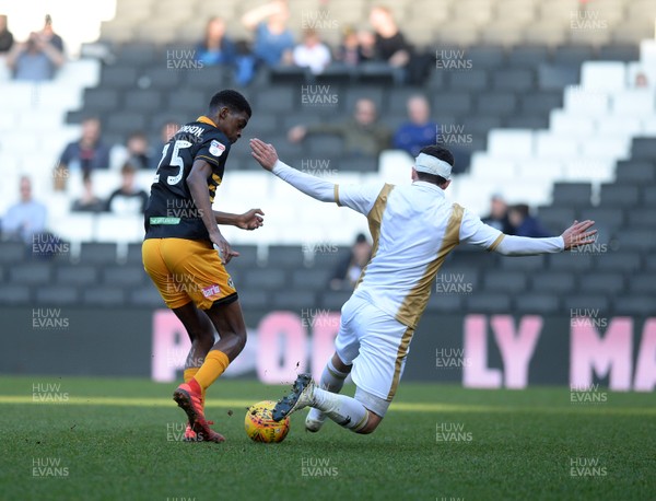 230219 MK Dons v Newport County - Sky Bet League 2 -   Newports Tyreeq Bakinson goes past Mathieu Baudry of MK Dons 