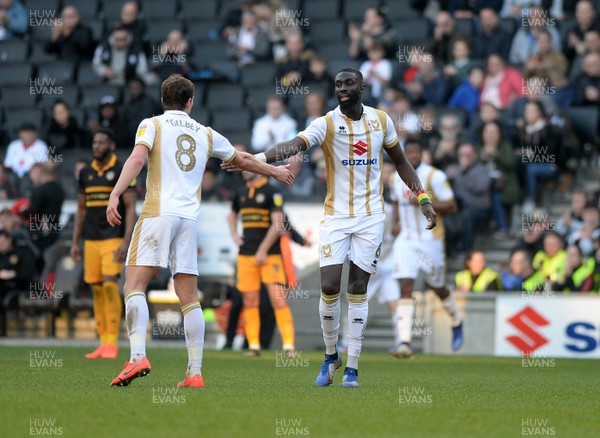 230219 - MK Dons v Newport County - Sky Bet League 2-   Ousseynou Cisse celebrates his goal for MK Dons with Alex Gilbey