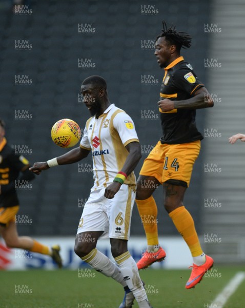 230219 - MK Dons v Newport County - Sky Bet League 2-   Ousseynou Cisse of MK Dons guarded by Adebayo Azeez of Newport