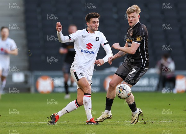 240224 - MK Dons v Newport County, EFL Sky Bet League 2 - Daniel Harvie of MK Dons and Will Evans of Newport County compete for the ball