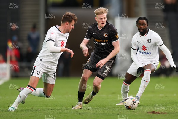 240224 - MK Dons v Newport County, EFL Sky Bet League 2 - Will Evans of Newport County takes on Ethan Robson of MK Dons