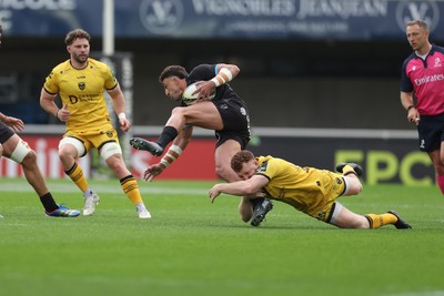 030526 - Montpellier Herault Rugby v Dragons RFC - EPCR Challenge Cup Semi Final - Tom Banks of Montpellier is tackled by Aneurin Owen of Dragons 