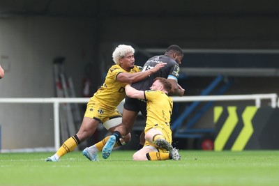 030526 - Montpellier Herault Rugby v Dragons RFC - EPCR Challenge Cup Semi Final - Lennox Anyanwu of Montpellier is tackled by Fine Inisi and Aneurin Owen of Dragons 
