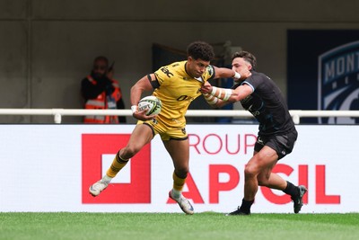 030526 - Montpellier Herault Rugby v Dragons RFC - EPCR Challenge Cup Semi Final - Rio Dyer of Dragons is tackled by Tom Banks of Montpellier 