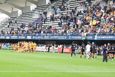 030526 - Montpellier Herault Rugby v Dragons RFC - EPCR Challenge Cup Semi Final - Dragons have a team picture taken in front of travelling fans after the match