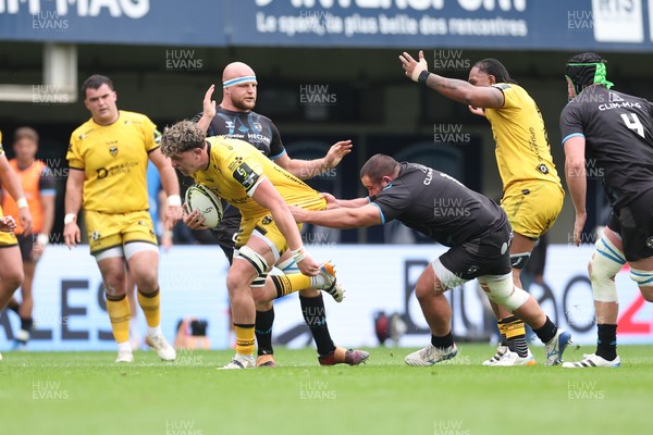 030526 - Montpellier Herault Rugby v Dragons RFC - EPCR Challenge Cup Semi Final - Ryan Woodman of Dragons is tackled by Baptiste Erdocio of Montpellier 