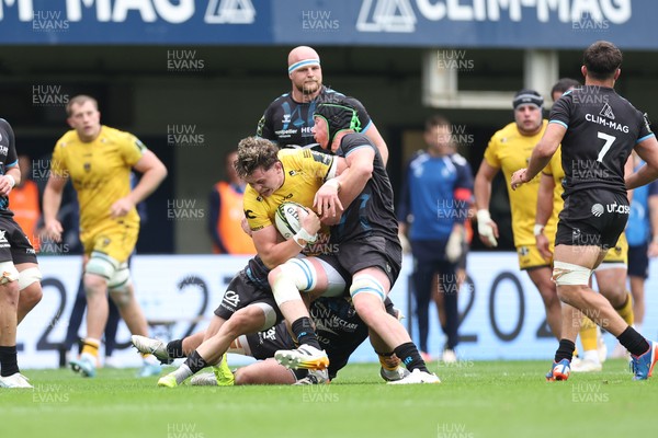 030526 - Montpellier Herault Rugby v Dragons RFC - EPCR Challenge Cup Semi Final - Ryan Woodman of Dragons is tackled by Adam Beard of Montpellier 