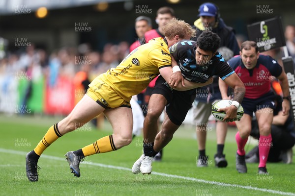 030526 - Montpellier Herault Rugby v Dragons RFC - EPCR Challenge Cup Semi Final - Donovan Taofifenua of Montpellier is tackled by Dai Richards of Dragons 