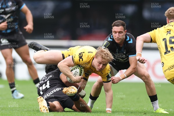 030526 - Montpellier Herault Rugby v Dragons RFC - EPCR Challenge Cup Semi Final - Dai Richards of Dragons is tackled by Donovan Taofifenua of Montpellier 
