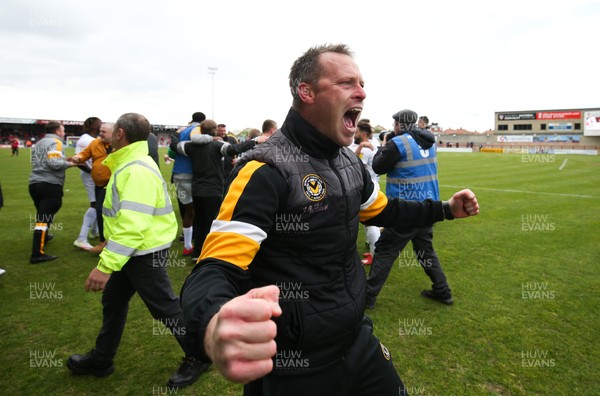 040519 - Morecambe v Newport County, Sky Bet League 2 - Newport County manager Michael Flynn celebrates on hearing the news that Newport County had made the Division 2 Play Offs