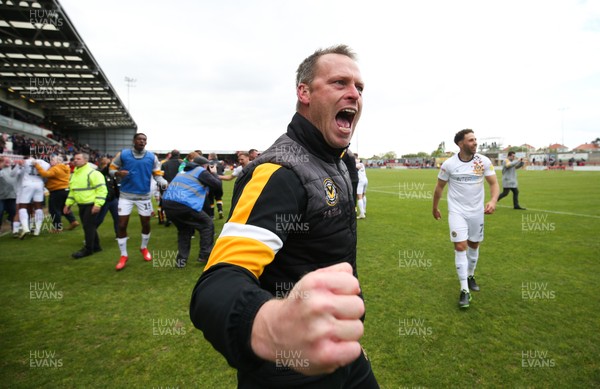 040519 - Morecambe v Newport County, Sky Bet League 2 - Newport County manager Michael Flynn celebrates on hearing the news that Newport County had made the Division 2 Play Offs
