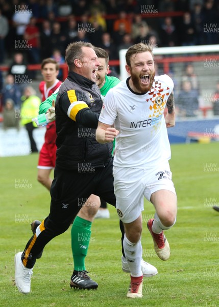 040519 - Morecambe v Newport County, Sky Bet League 2 - Newport County manager Michael Flynn and Mark O'Brien of Newport County celebrate on hearing the news that Newport County had made the Play Offs