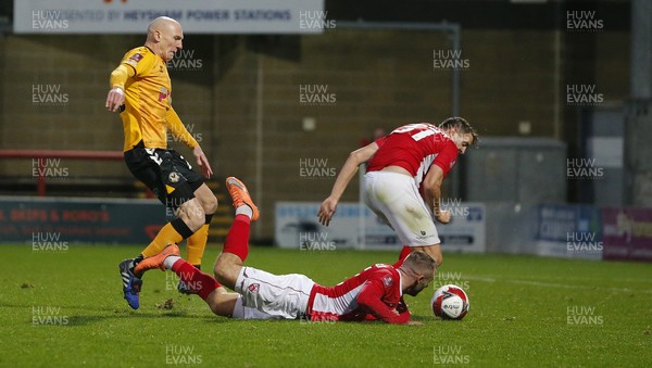 061121 - Morecambe v Newport County - FA Cup First Round - Kevin Ellison of Newport County battles for the ball with Ryan McLaughlin of Morecambe FC and Scott Wootton of Morecambe FC in the box