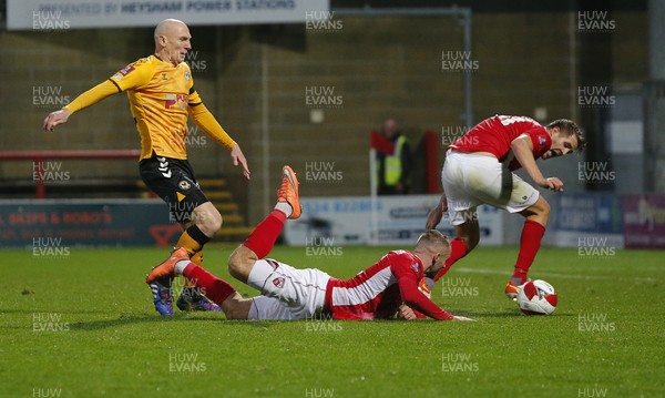 061121 - Morecambe v Newport County - FA Cup First Round - Kevin Ellison of Newport County battles for the ball with Ryan McLaughlin of Morecambe FC and Scott Wootton of Morecambe FC in the box