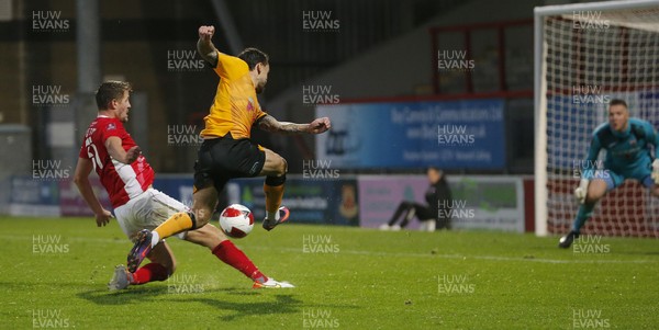 061121 - Morecambe v Newport County - FA Cup First Round - Dom Telford of Newport County tries a shot on goal with Scott Wootton of Morecambe FC in attendance