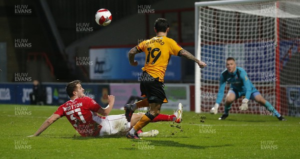 061121 - Morecambe v Newport County - FA Cup First Round - Dom Telford of Newport County tries a shot on goal with Scott Wootton of Morecambe FC in attendance