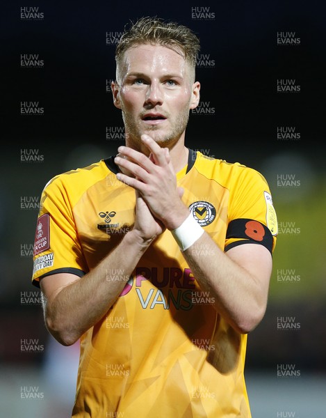 061121 - Morecambe v Newport County - FA Cup First Round - Cameron Norman of Newport County applauds the fans 