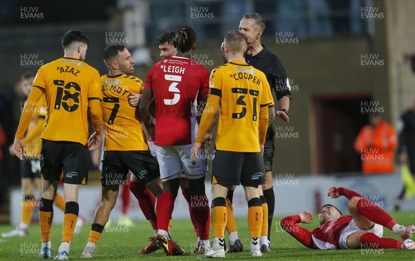 061121 - Morecambe v Newport County - FA Cup First Round - Robbie Willmott of Newport County is cautioned as Morecambe player is on ground